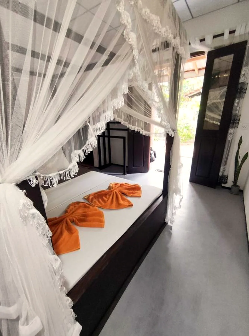 Deluxe Single Room with a neat single bed and garden light